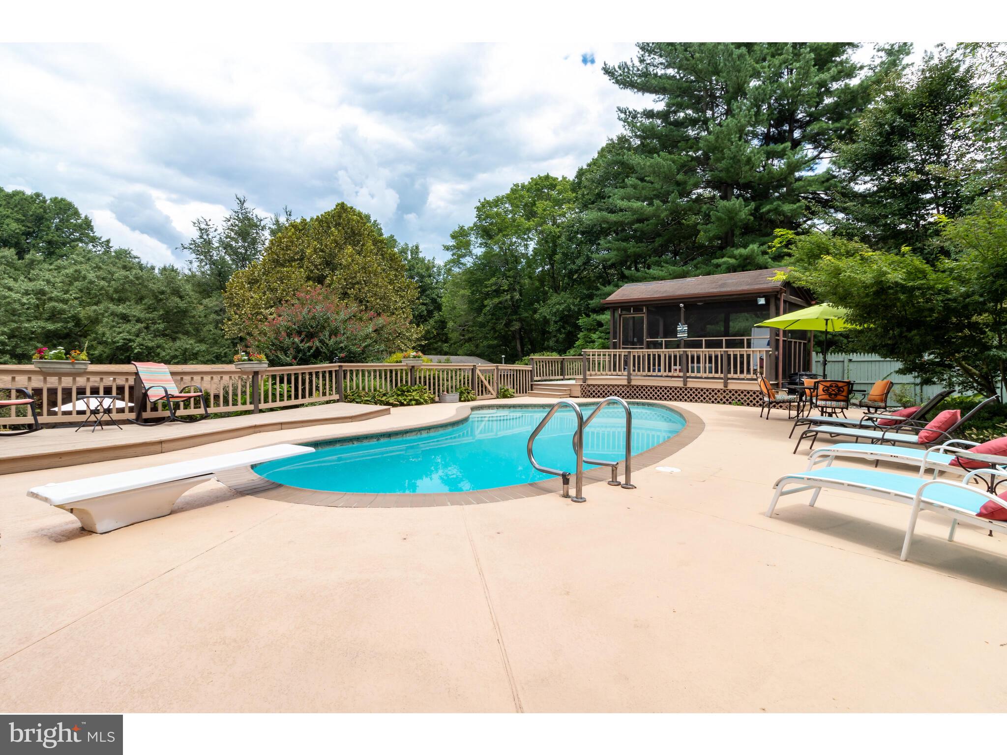 246 Chesterville Road Landenberg, PA 19350 - Photo 19 of 62 a view of a swimming pool with a lounge chair