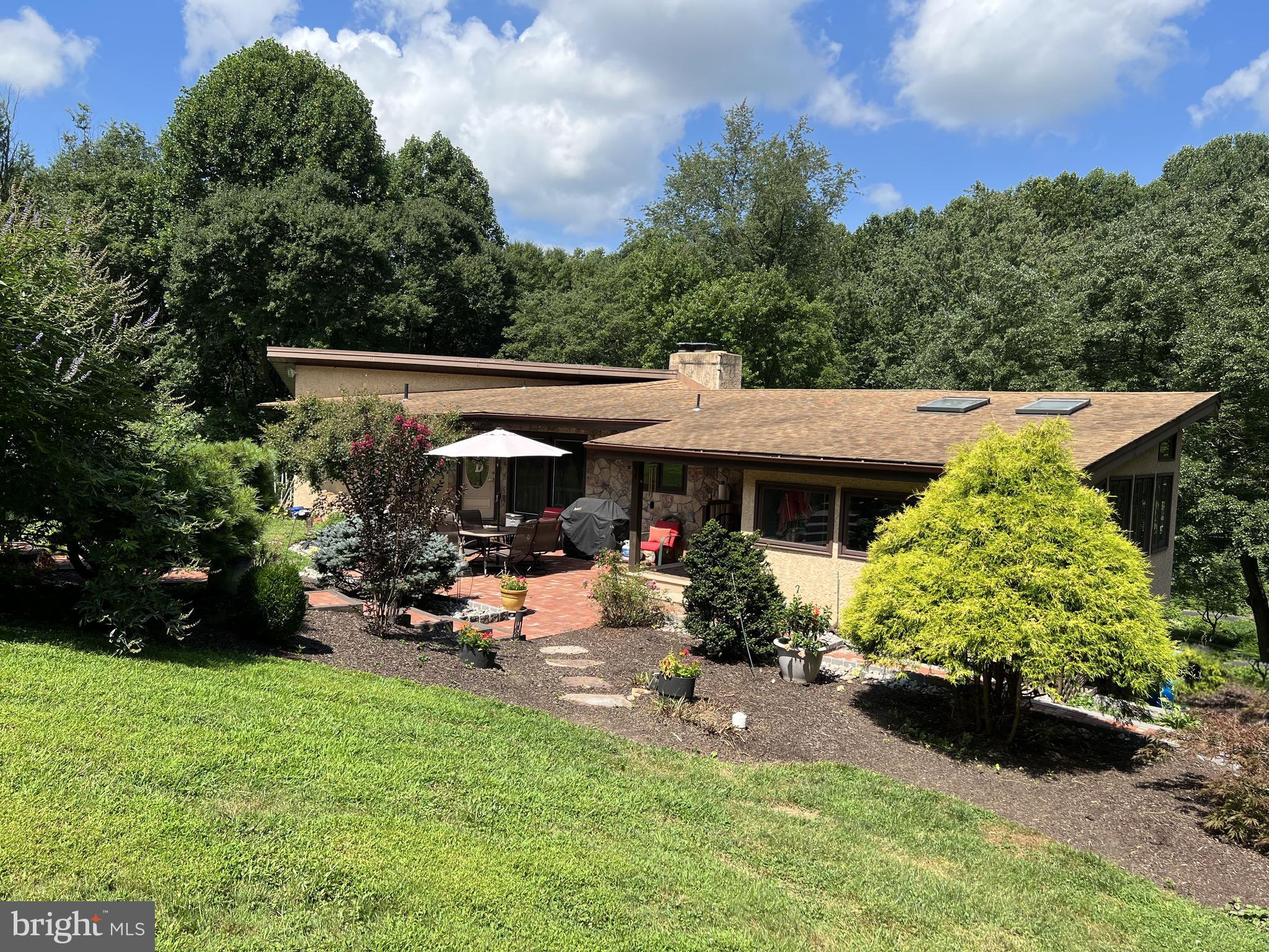 246 Chesterville Road Landenberg, PA 19350 - Photo 2 of 62 a view of a house with backyard sitting area and garden