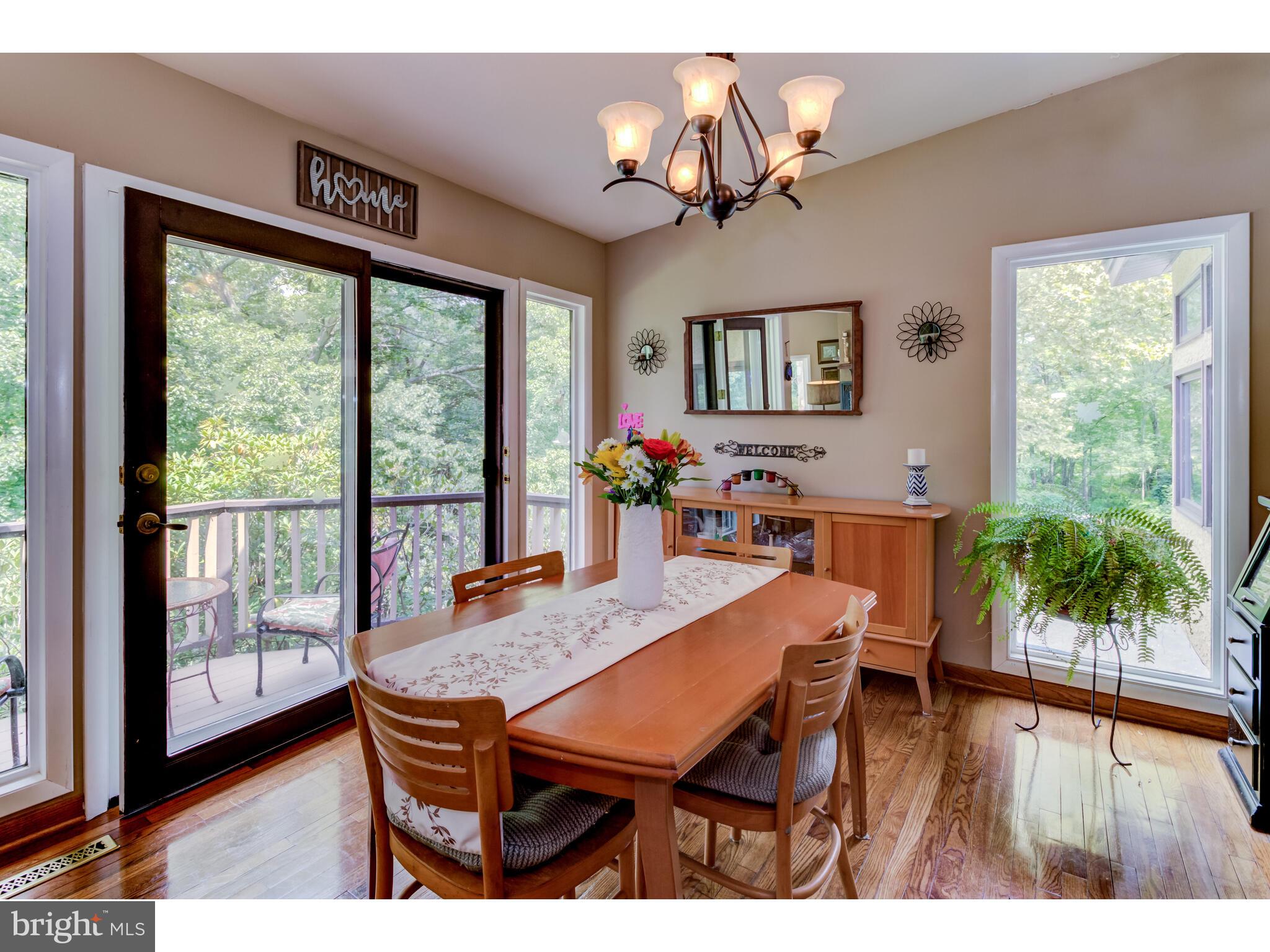 246 Chesterville Road Landenberg, PA 19350 - Photo 33 of 62 a dining room with furniture a chandelier and wooden floor