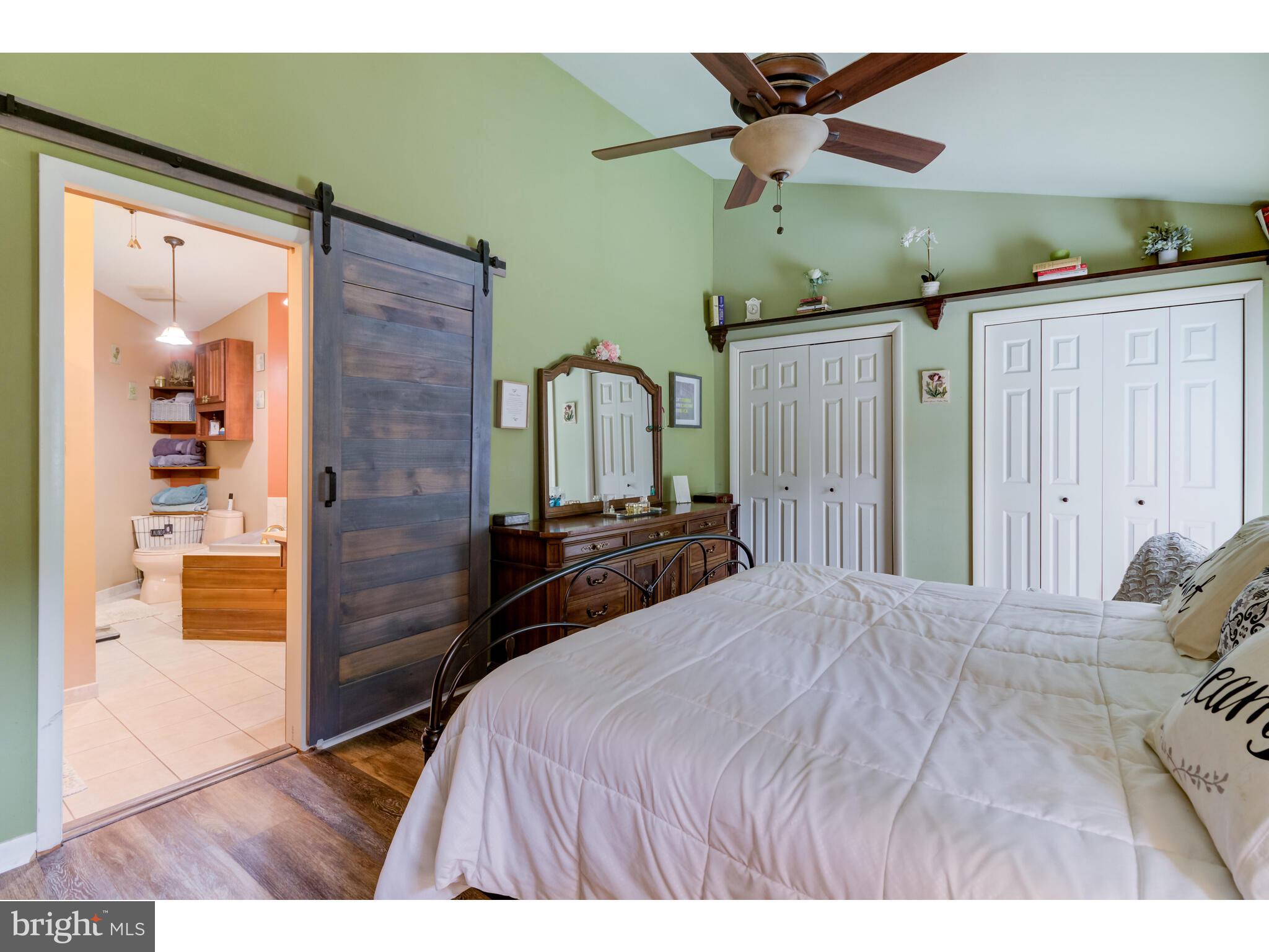 246 Chesterville Road Landenberg, PA 19350 - Photo 45 of 62 a bedroom with a bed and a large mirror
