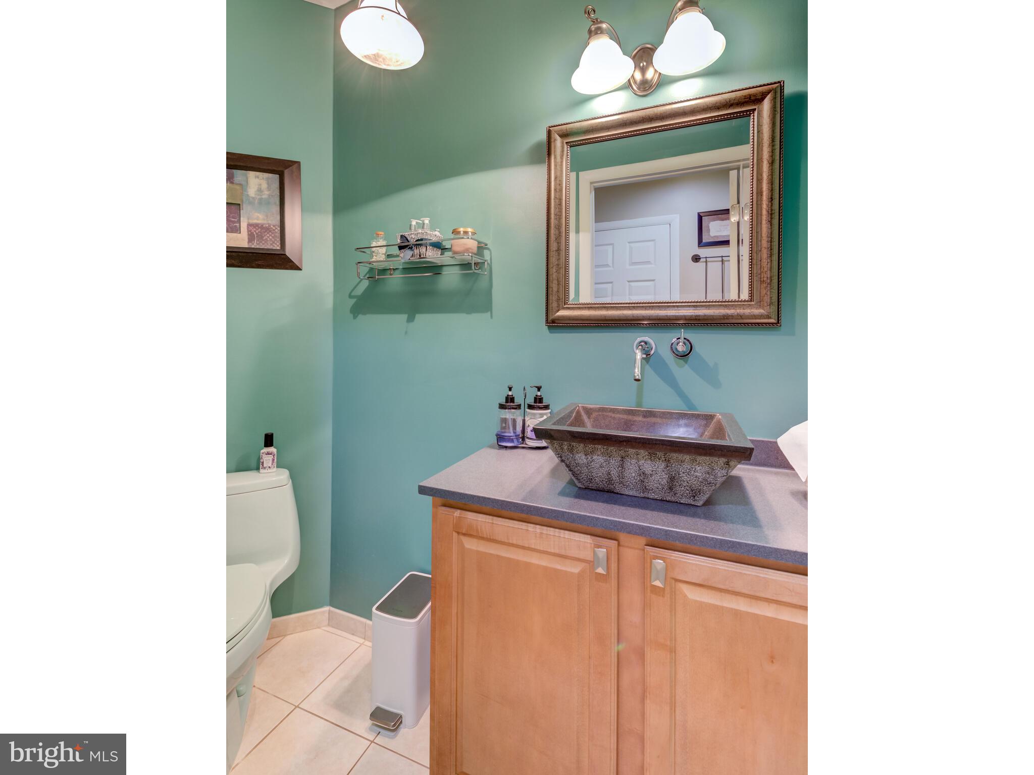 246 Chesterville Road Landenberg, PA 19350 - Photo 51 of 62 a bathroom with a sink toilet and mirror