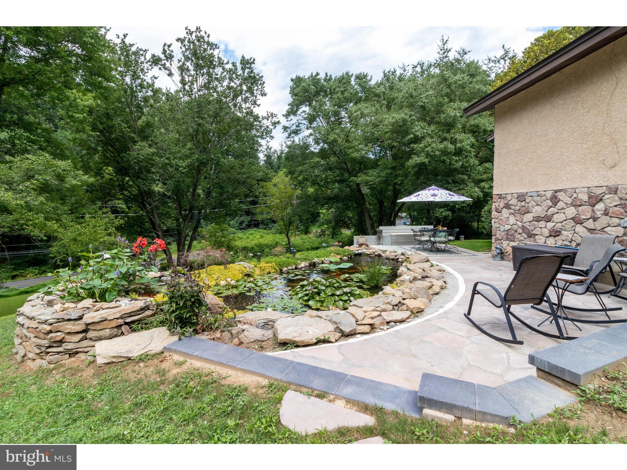 246 Chesterville Road Landenberg, PA 19350 - Photo 9 of 62 a view of a backyard with sitting area