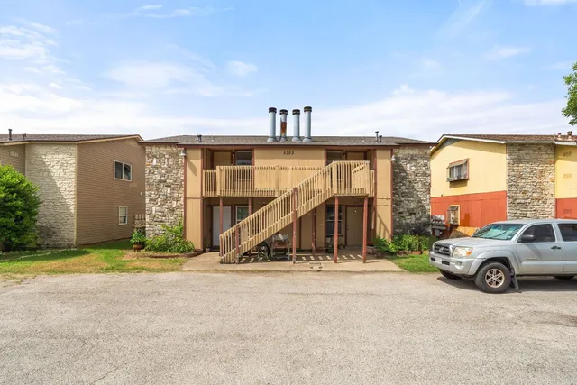a view of a car park in front of house