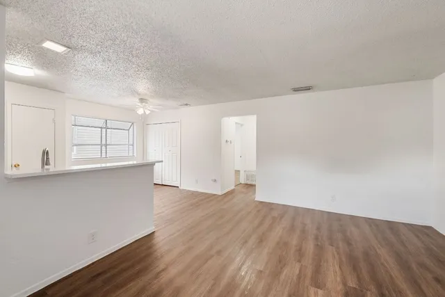 a view of kitchen with wooden floor and window