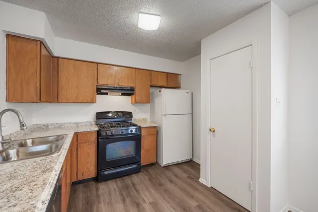 a kitchen with appliances and cabinets