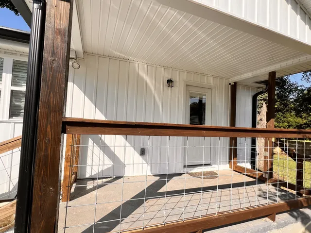 a view of balcony with wooden floor