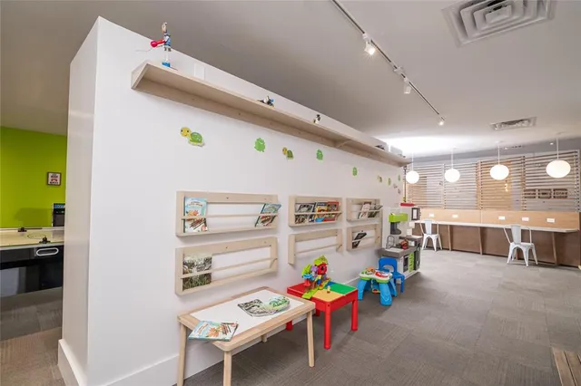 a play room with furniture and a window