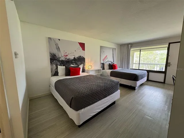 a bedroom with bed and window