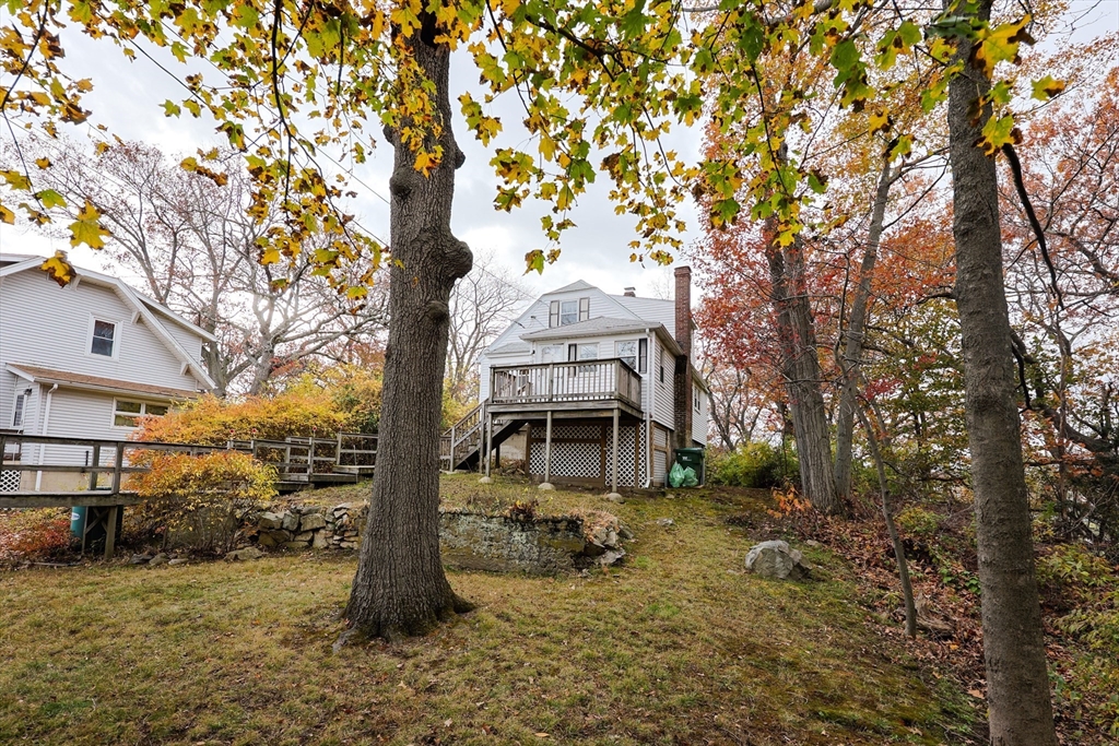 52 Harrison Street Medford, MA 02155 - Photo 4 of 42 a front view of a house with a yard