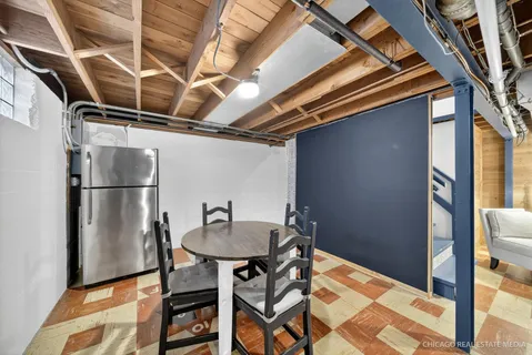 a backyard of a house with table and chairs