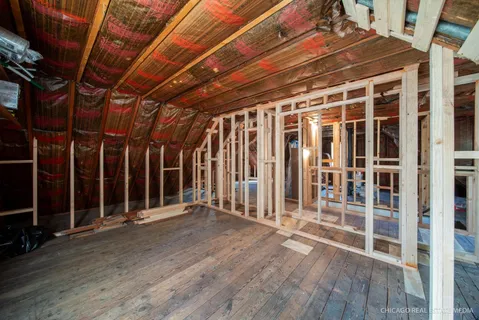 a view of an empty room with stairs