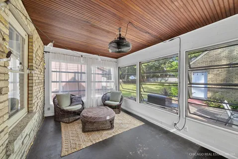 a lobby with furniture and a floor to ceiling window