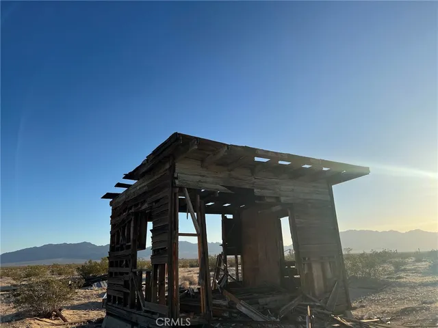 a front view of a house with mountain view