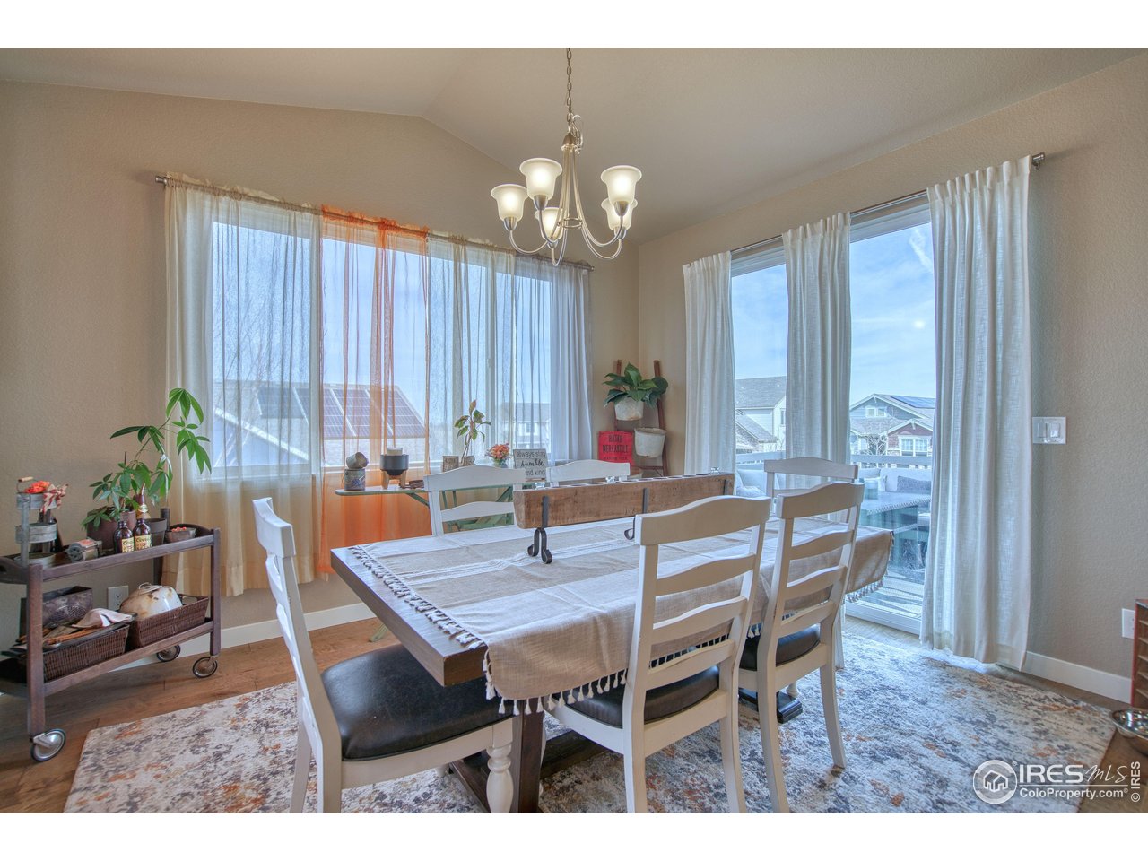 810 Ranchhand Drive Berthoud, CO 80513 - Photo 11 of 40 Separate dining room has a vaulted ceiling & room for your extended table.