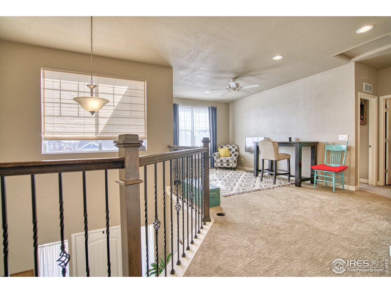 810 Ranchhand Drive Berthoud, CO 80513 - Photo 15 of 40 Gorgeous wooden banisters & iron spindles add a designer touch.