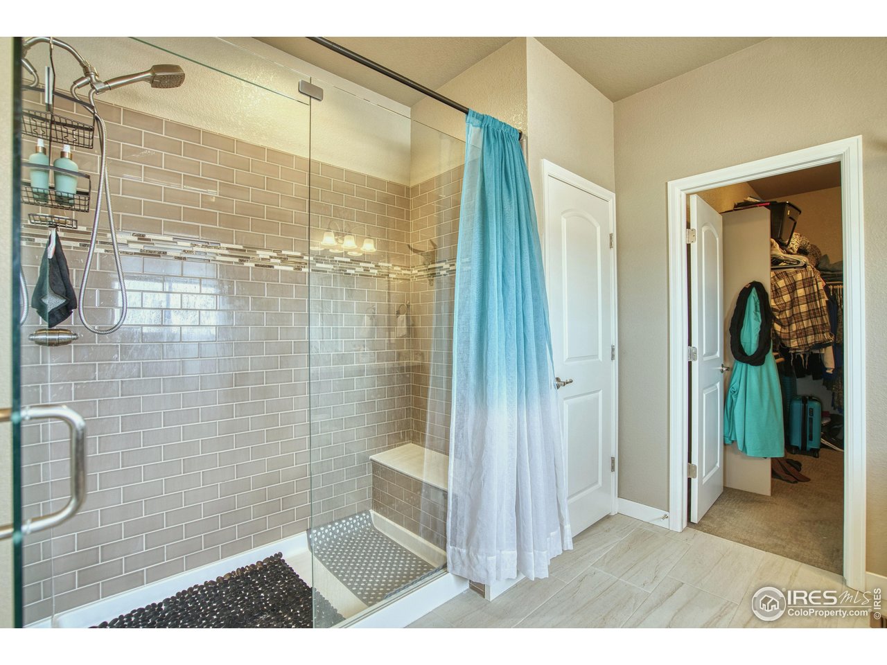 810 Ranchhand Drive Berthoud, CO 80513 - Photo 20 of 40 Double shower stall with bench, linen closet & walk-in closet.