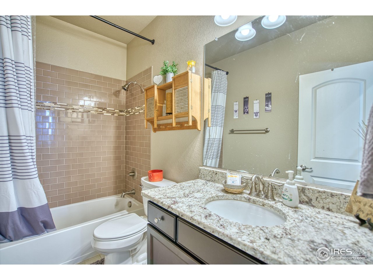 810 Ranchhand Drive Berthoud, CO 80513 - Photo 22 of 40 Full hall bath has fine finishes.