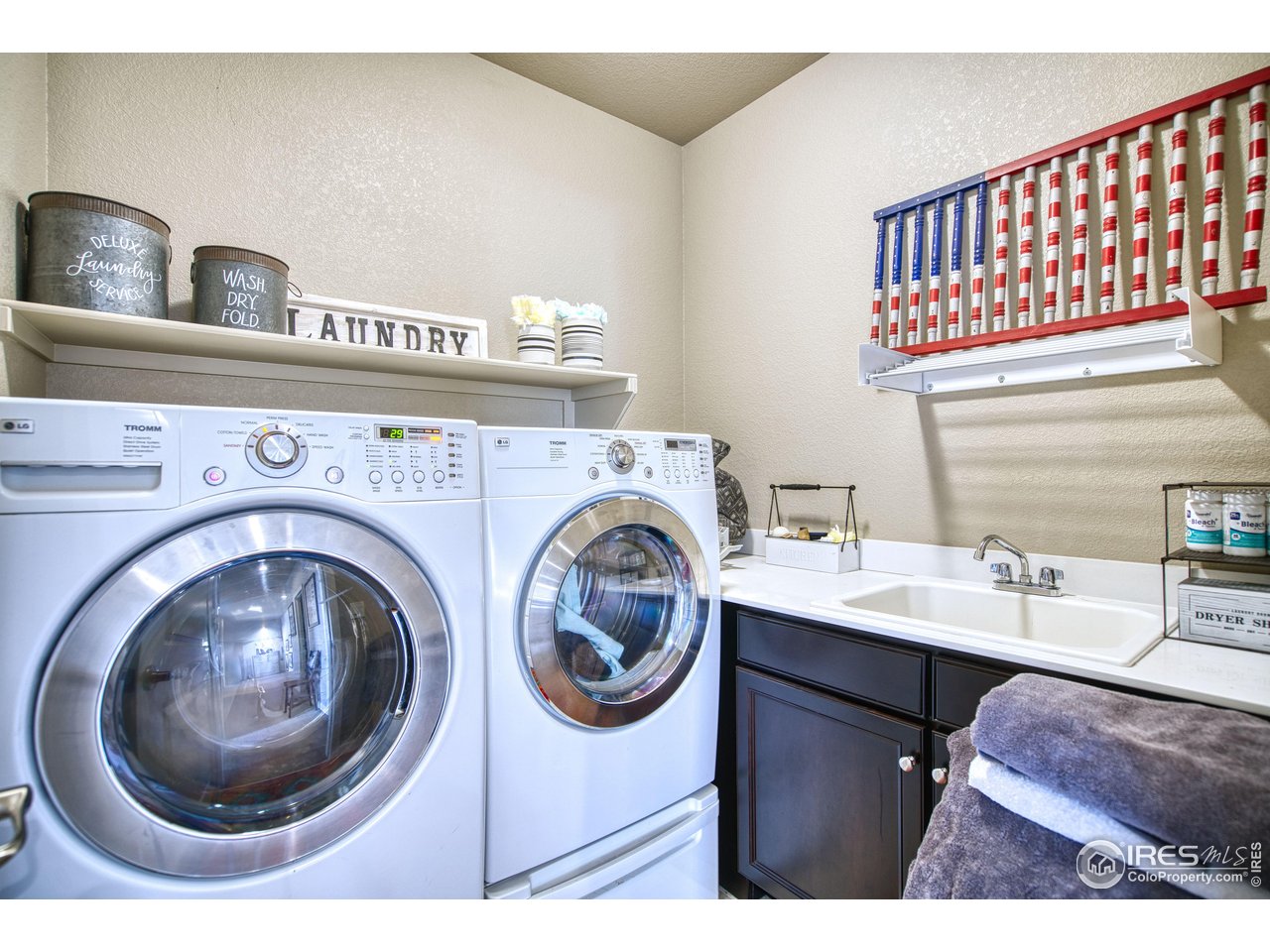 810 Ranchhand Drive Berthoud, CO 80513 - Photo 24 of 40 Laundry room with tub sink is located on the upper level. Washer & dryer are included!