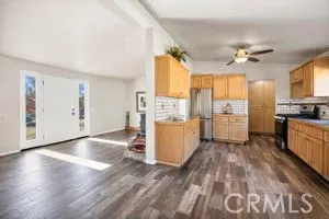 a view of a kitchen with a stove cabinets and wooden floor