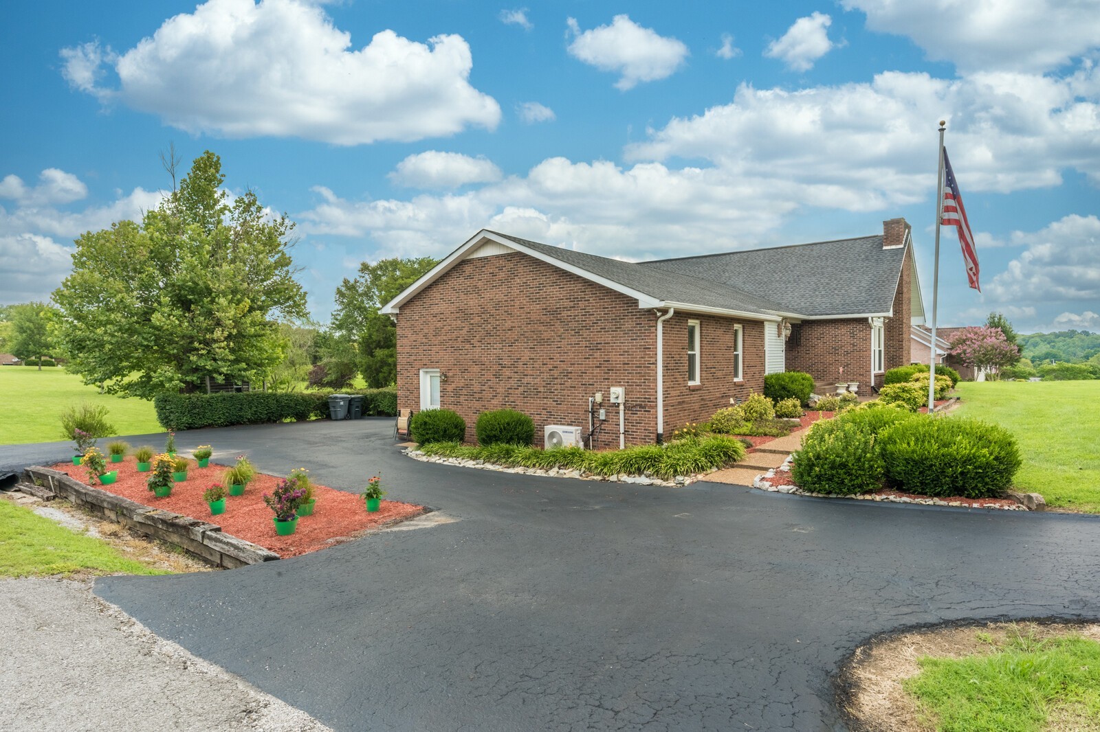 387 Ranch Road Portland, TN 37148 - Photo 17 of 39 a front view of a house with a yard and garage