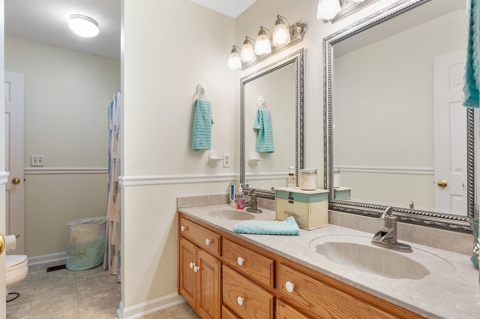 387 Ranch Road Portland, TN 37148 - Photo 32 of 39 a bathroom with a granite countertop sink and a mirror