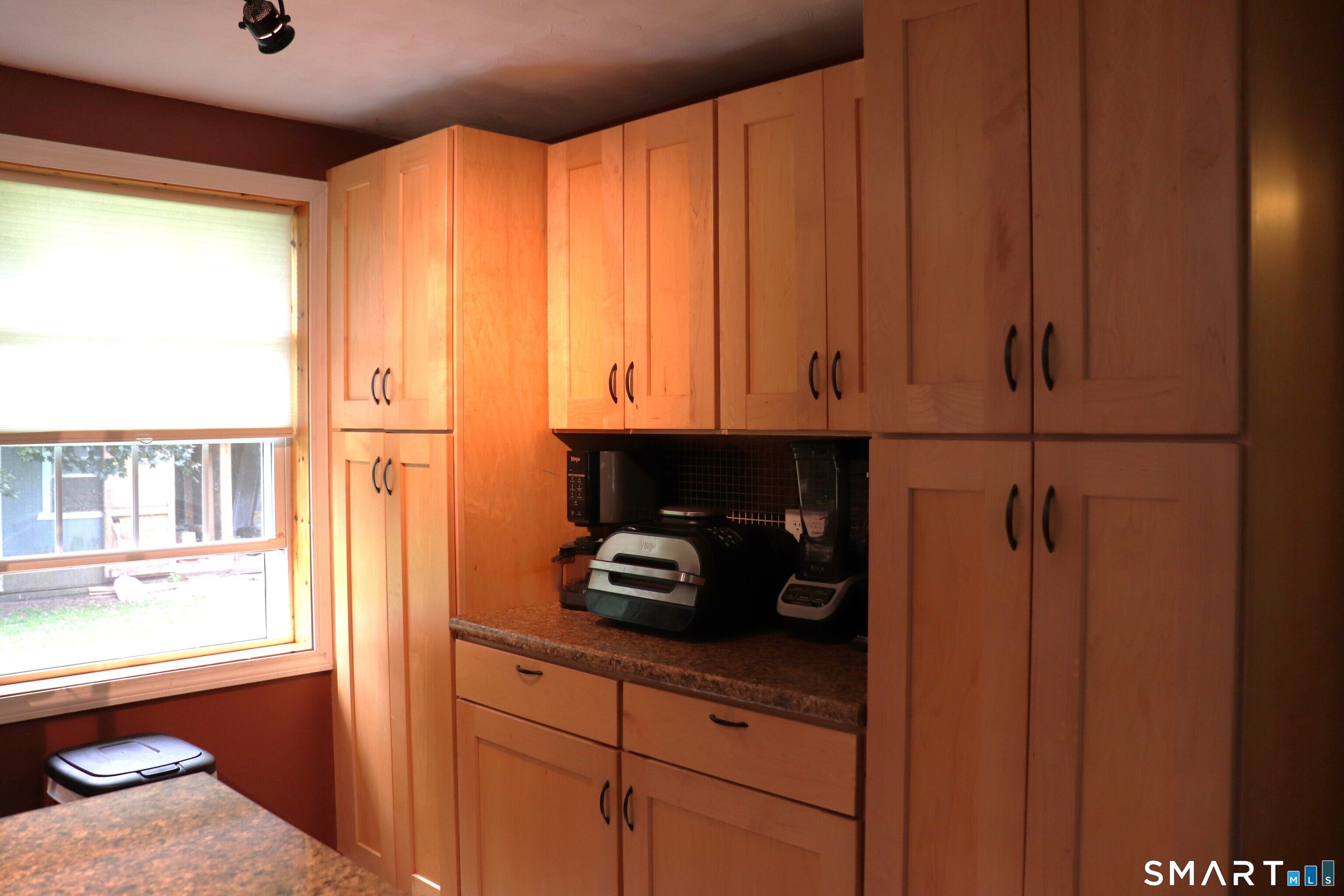 308 Abbe Road Enfield, CT 06082 - Photo 16 of 33 a kitchen with a window and cabinets