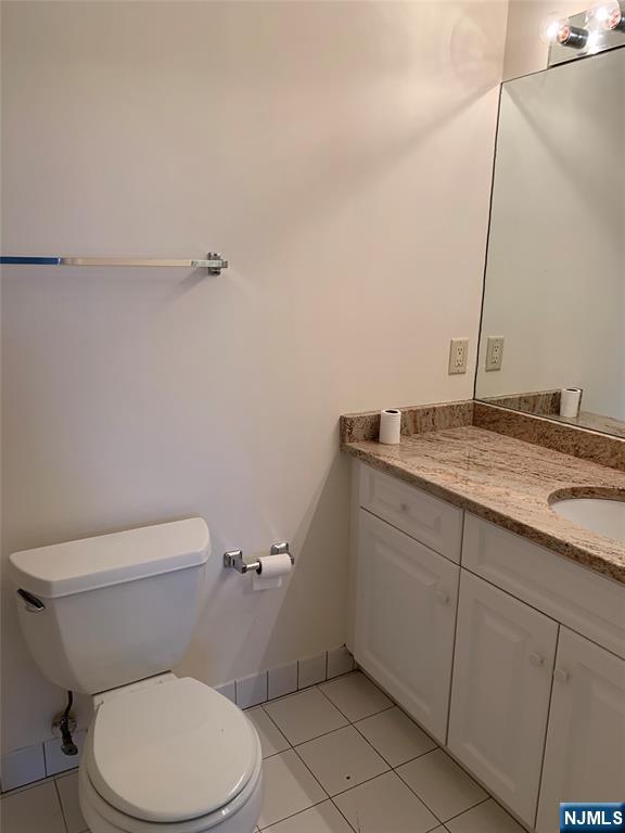 166 Stonegate Trail Cresskill, NJ 07626 - Photo 13 of 28 a bathroom with a granite countertop toilet and a sink