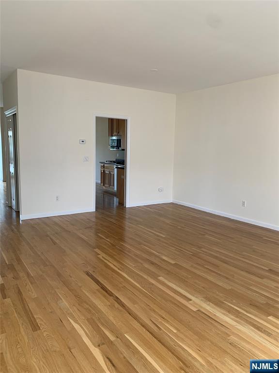 166 Stonegate Trail Cresskill, NJ 07626 - Photo 3 of 28 a view of empty room with wooden floor