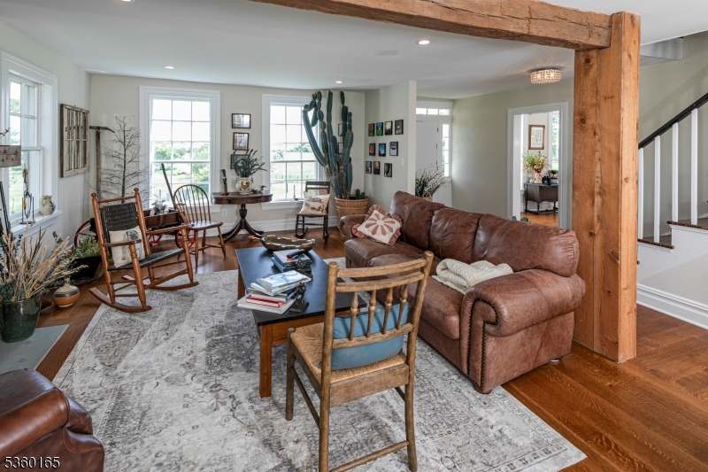 760 Rosemont Ringoes Road Stockton, NJ 08559 - Photo 13 of 49 a living room with furniture wooden floor and a large window