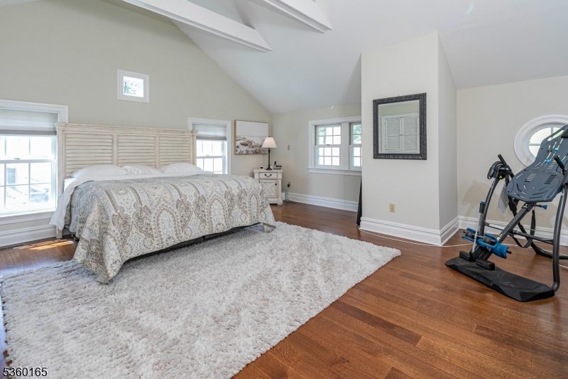 760 Rosemont Ringoes Road Stockton, NJ 08559 - Photo 16 of 49 a spacious bedroom with a bed and wooden floor