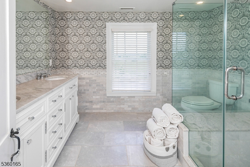 760 Rosemont Ringoes Road Stockton, NJ 08559 - Photo 17 of 49 a bathroom with a granite countertop sink a toilet and shower