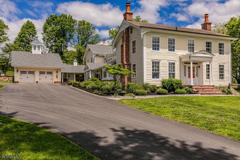 760 Rosemont Ringoes Road Stockton, NJ 08559 - Photo 2 of 49 a front view of a house with a yard and garage