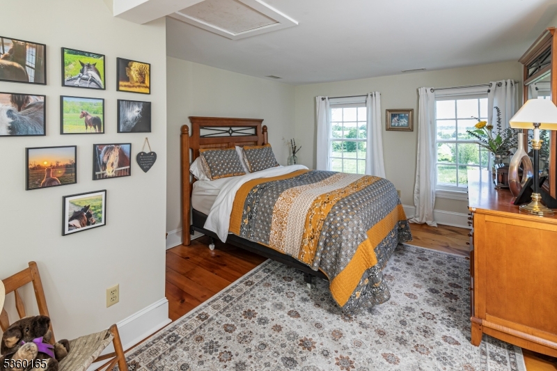 760 Rosemont Ringoes Road Stockton, NJ 08559 - Photo 21 of 49 a bed sitting in a bedroom next to a window