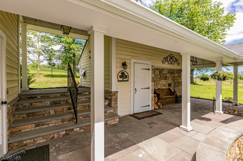 760 Rosemont Ringoes Road Stockton, NJ 08559 - Photo 30 of 49 a view of a porch with a door