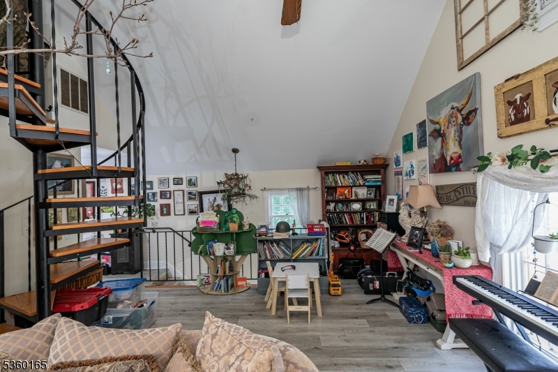 760 Rosemont Ringoes Road Stockton, NJ 08559 - Photo 35 of 49 a living room with lots of furniture and a book shelf