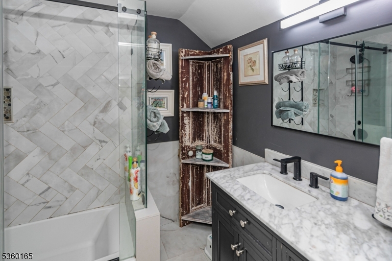 760 Rosemont Ringoes Road Stockton, NJ 08559 - Photo 38 of 49 a bathroom with a granite countertop sink a mirror and shower