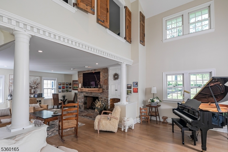 760 Rosemont Ringoes Road Stockton, NJ 08559 - Photo 8 of 49 a living room with furniture a fireplace and a flat screen tv