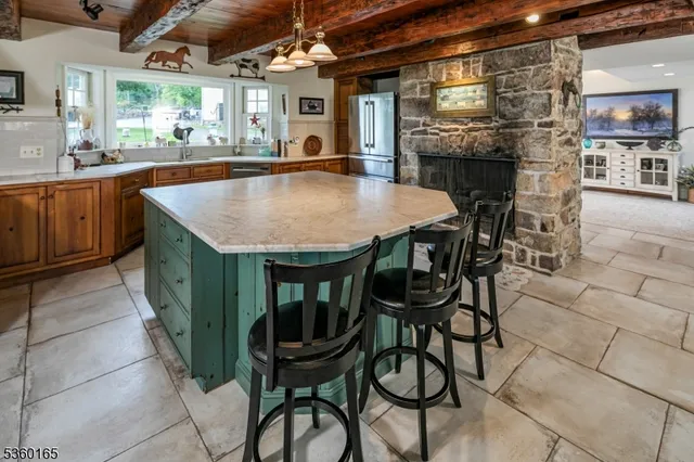 a view of a dining room with furniture and window