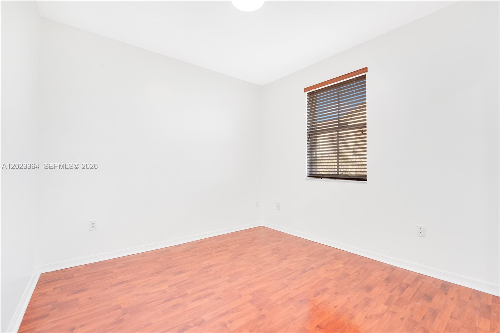 27433 Southwest 137th Court, Unit 1 Homestead, FL 33032 - Photo 14 of 28 a view of an empty room with a window