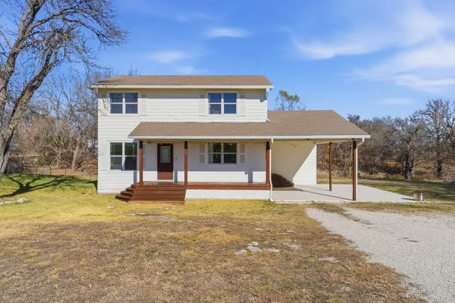 front view of a house with a yard