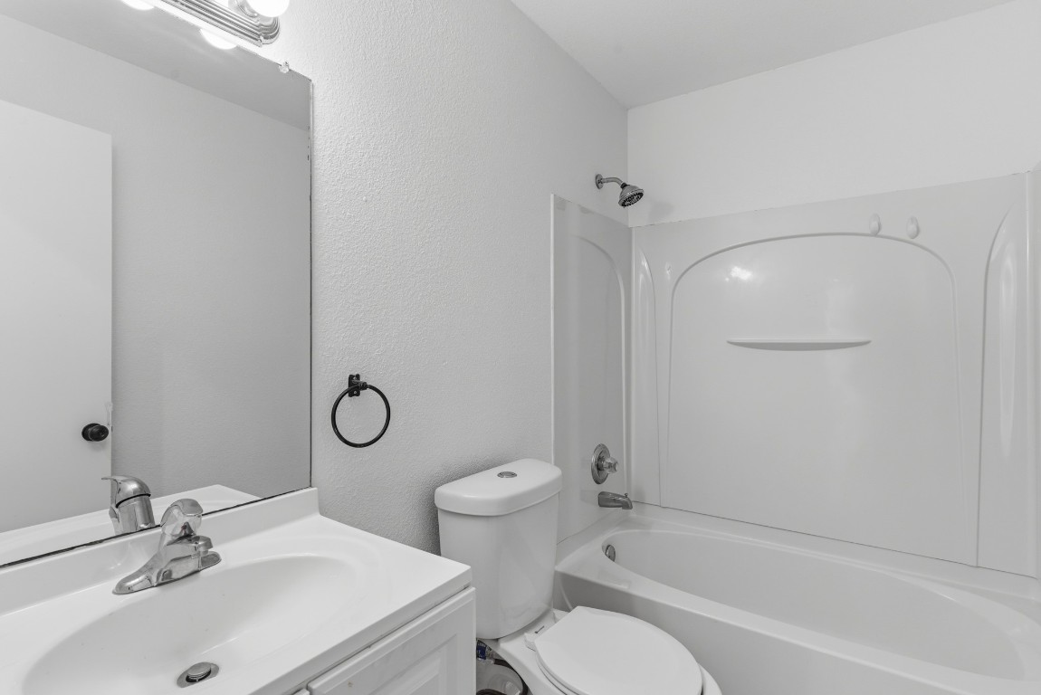 93 County Road 130 Georgetown, TX 78626 - Photo 22 of 27 a bathroom with a sink toilet and shower