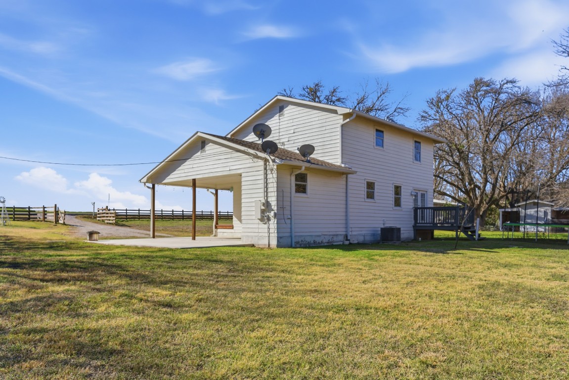 93 County Road 130 Georgetown, TX 78626 - Photo 26 of 27 a big house with a big yard and large trees