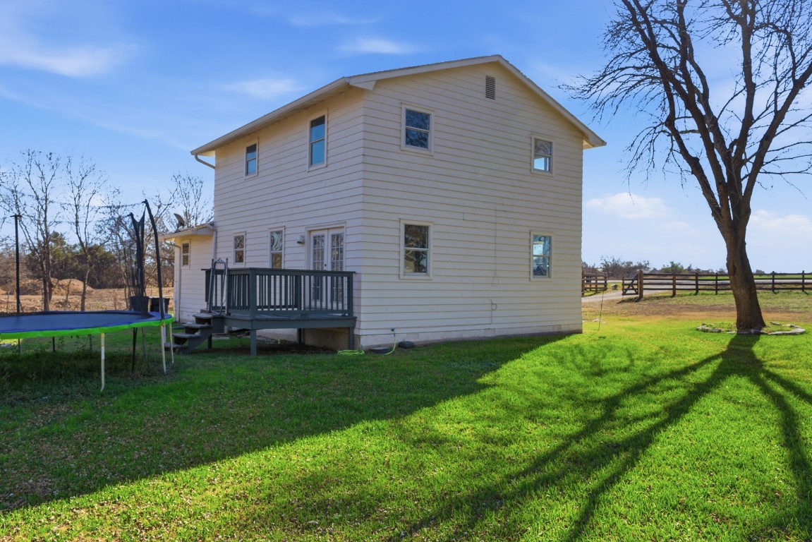 93 County Road 130 Georgetown, TX 78626 - Photo 4 of 27 a view of backyard with table and chairs and a barbeque