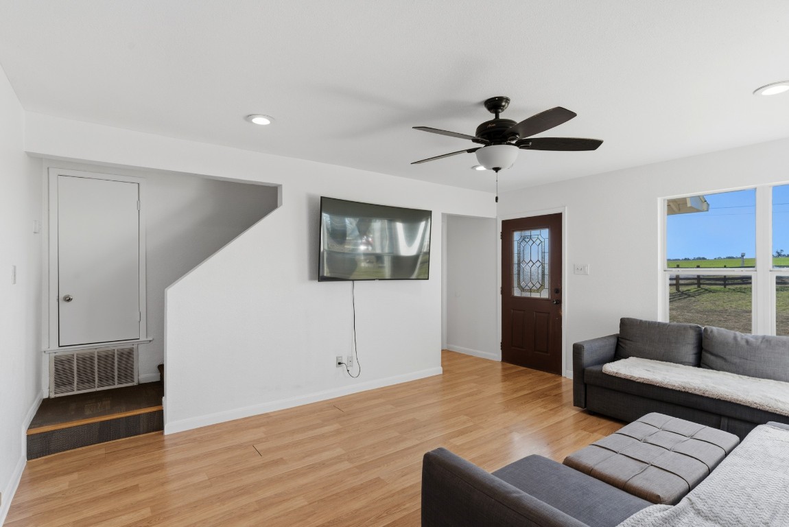 93 County Road 130 Georgetown, TX 78626 - Photo 9 of 27 a living room with furniture and a wooden floor