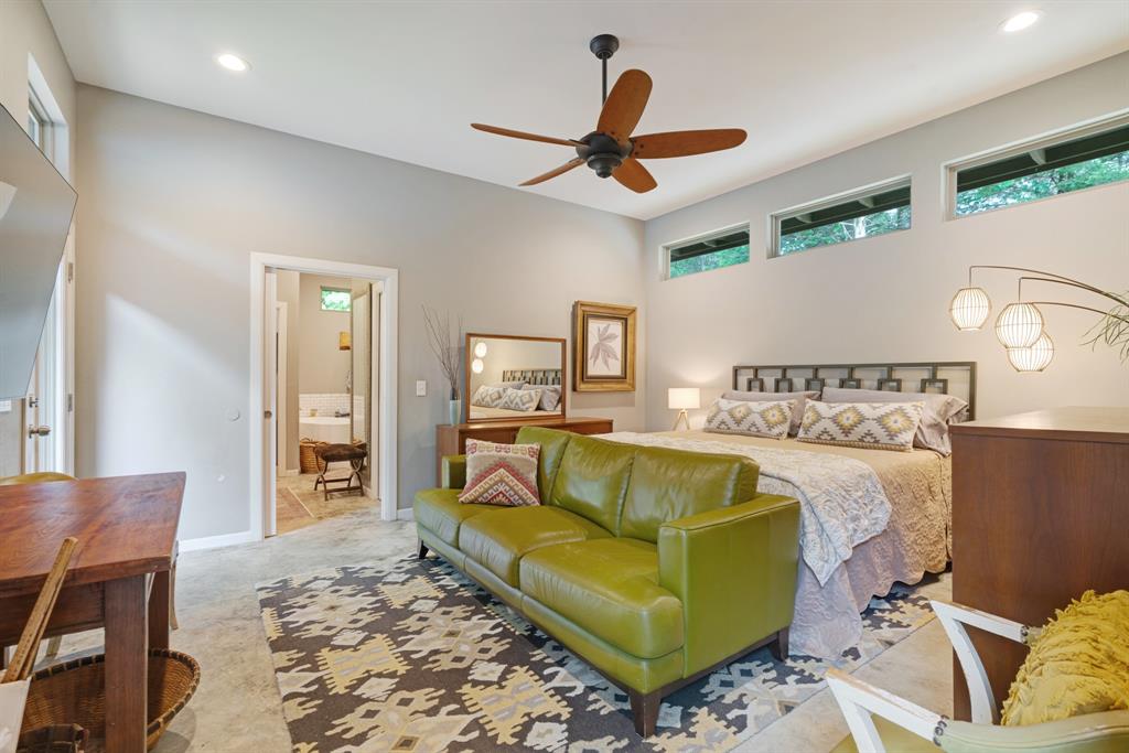 323 County Road Powderly, TX 75473 - Photo 17 of 36 a living room with furniture and a chandelier