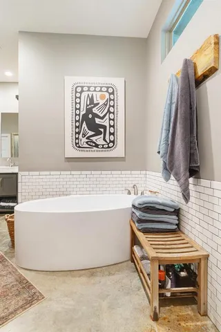 a bathroom with a bathtub and a sink