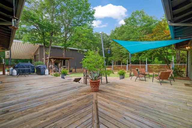 a view of a backyard with sitting area