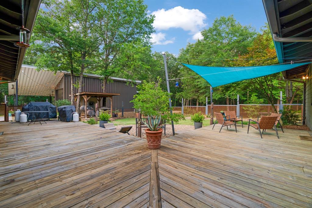 323 County Road Powderly, TX 75473 - Photo 24 of 36 a view of a backyard with sitting area