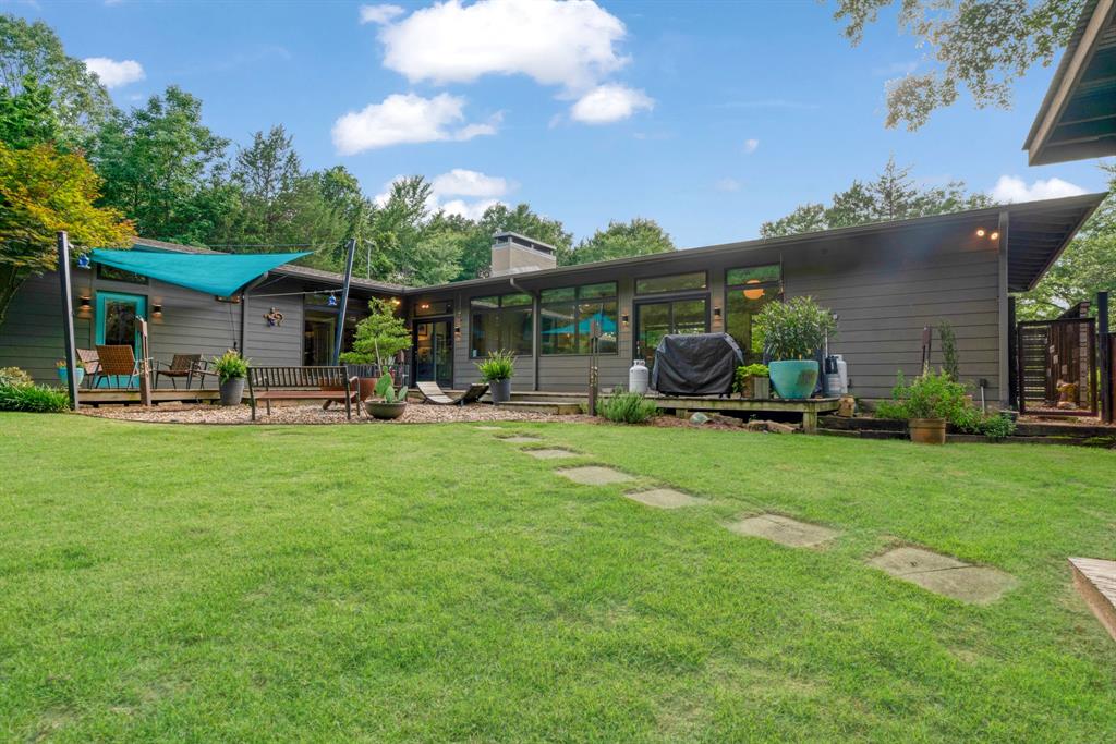 323 County Road Powderly, TX 75473 - Photo 25 of 36 a front view of a house with garden