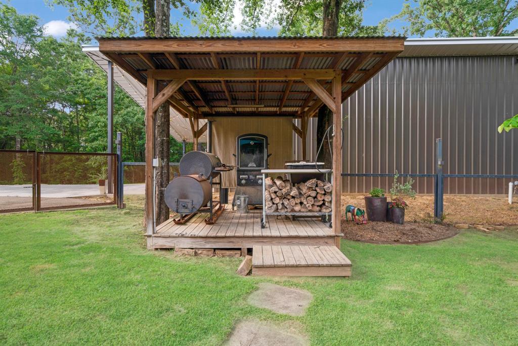 323 County Road Powderly, TX 75473 - Photo 26 of 36 a view of a chair and table in backyard of the house